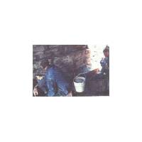 Pressure grouting the South abutment;
The work is observed by a member of the 
local bat group (far right)